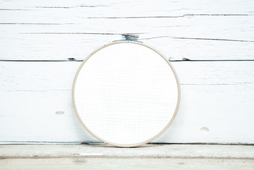 hoops for embroidery on a wooden background - a round layout for embroidery - round hoops for...