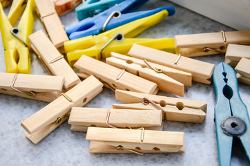 Multicolored Laundry clips on the grey backround