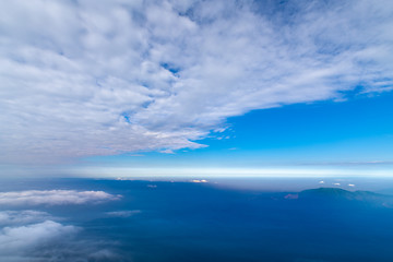 Naklejka na ściany i meble The sea of clouds under the blue sky and white clouds, Emei mountain, Sichuan province, China