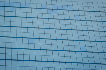 Blue glass windows of office building