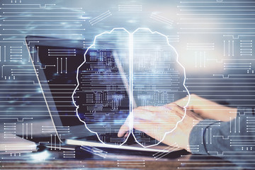 Man typing on keyboard background with brain hologram. Concept of big Data. Double exposure.