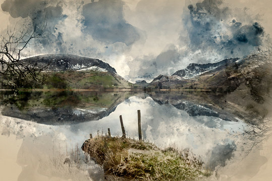 Digital watercolor painting of Beautiful Winter landscape image of Llyn Nantlle in Snowdonia National Park with snow capped mountains in background © veneratio