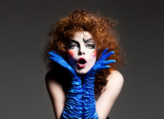 Woman mime with theatrical makeup. Studio shot.