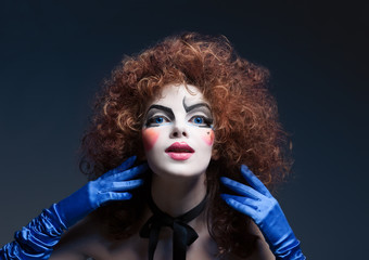 Woman mime with theatrical makeup. Studio shot.