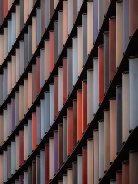 Colored window shutters on a large wall