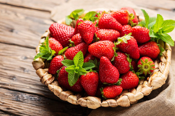 Summer sweet red strawberry on the wooden table