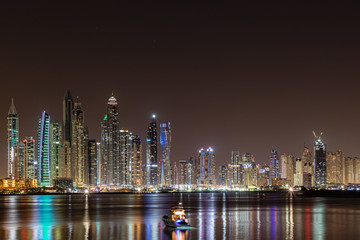 A peaceful view of Dubai Marina Skyline by night from the Oceana residence in Palm