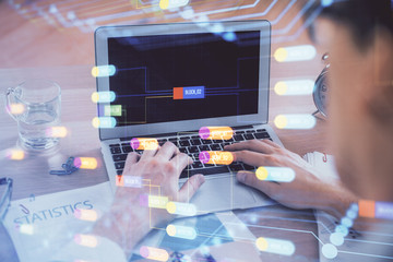 Businessman with computer background with technology theme hologram. Concept of big data. Double...
