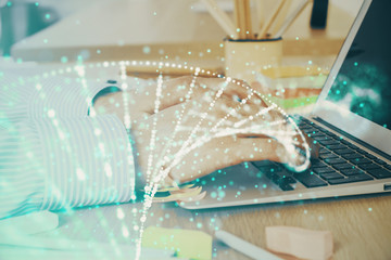 DNA hologram with businessman working on computer on background. Concept of bioengineering. Double...