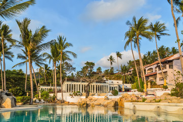 Tropical bungalows on rock beach