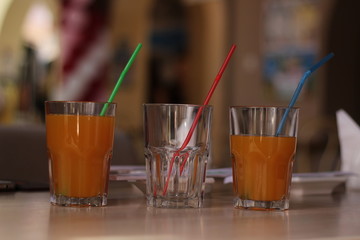 three glasses with juice. concept of choice