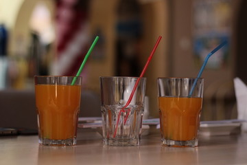 three glasses with juice. concept of choice