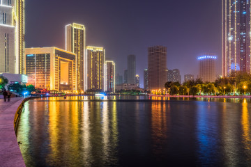 illuminated city waterfront downtown skyline with Haihe river,Tianjin,China.