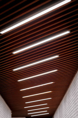 lighting lamps on the ceiling in the corridor