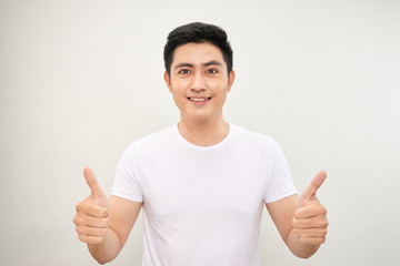 young asian man showing two thumbs up sign
