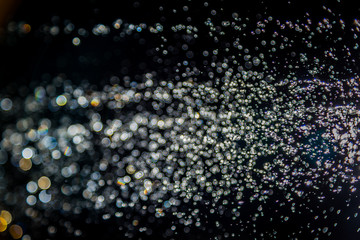 Colorful blur bokeh defocused on black