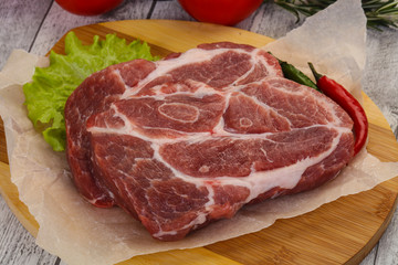 Raw pork neck steak