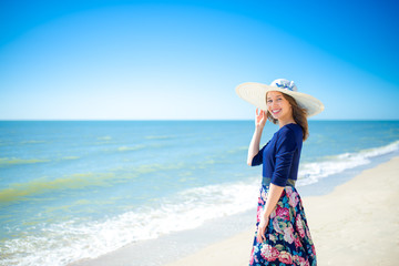 Beautiful girl in a dress on the beach, fashion woman, sea, sunny island