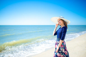 Beautiful girl in a dress on the beach, fashion woman, sea, sunny island