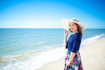 Beautiful girl in a dress on the beach, fashion woman, sea, sunny island