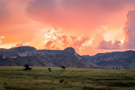Isalo National Park, Madagascar. Incredible clouds and colors in the sky above the famous rock formation with grass plain  on the foreground