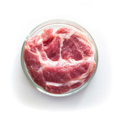 Minced meat in glass Petri dish. Laboratory studies of artificial meat. Close up. View from above. Chemical experiment.