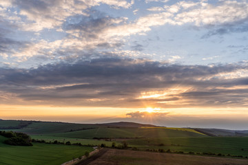 Scenic view of colorful sunset over beautiful rural countryside.