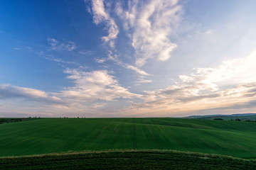 Scenic view of beautiful country landscape. Clouds passing above rural fields in South Moravia, Czech Republic.