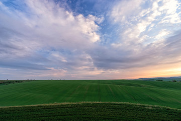 Scenic view of beautiful country landscape. Clouds passing above rural fields in South Moravia, Czech Republic.