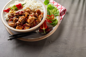 Overhead view of hot meal plate including rice