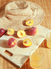 Peaches on a wooden board. Summer mood. Top view.