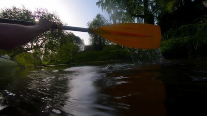 Rowing Yellow Paddle While Kayaking. Slow Motion