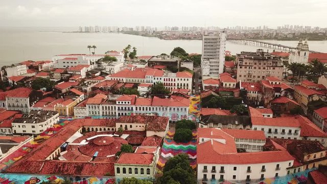 Aerial view Market of Tulhas and historical buildings decorated by the government with flags of sao joao in the center of the city of sao luis do maranhao, brazil.
