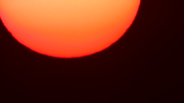 huge setting sun in the evening