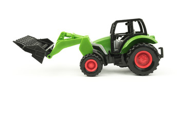 A small copy of the excavator. Toy tractor. Separate on a white background.