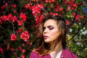 Naklejka premium Girl in harmony with nature. Natural environment organic cosmetics. Spring freshness. Blooming trees flowers. Natural beauty. Pretty woman skincare. Natural cosmetics concept. Makeup skin care