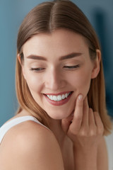 Beauty portrait of smiling woman with white teeth smile