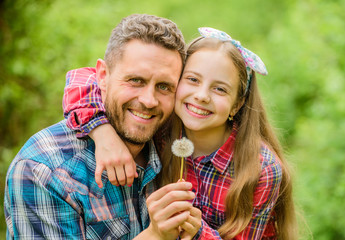 daughter and father with dandelion flower. family summer farm. little girl and happy man dad. earth...