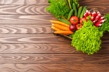Mix of vegetables in wooden box with copyspace