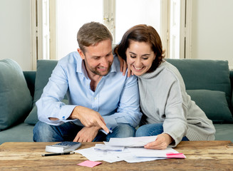 happy young couple feeling proud of home finance