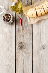 Fresh baguette on wooden table. Food background