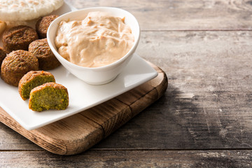 Falafel on a plate on wooden table.Copyspace.  Middle east food