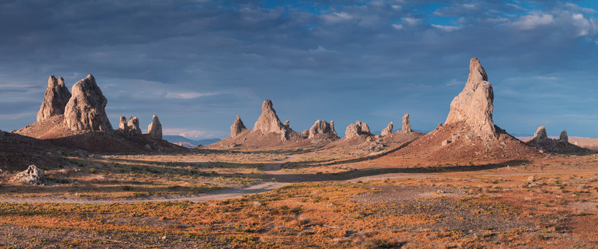 Trona Pinnacles are nearly 500 tufa spires hidden in California Desert National Conservation Area, not far from the Death Valley National Park, California, USA. Sunset landscape with beautiful rocks.