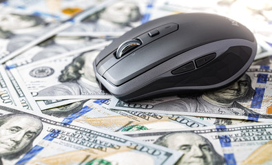 Wireless mobile mouse on 100 dollar background
