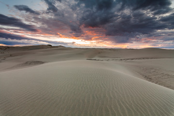 Fototapeta na wymiar Beautiful desert landscape with a colorful sunset. Desert background.