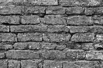 Old grungy brick wall texture in black and white.