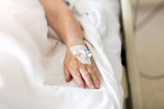 Cropped Image Of Patient With Iv Drip At Hospital 