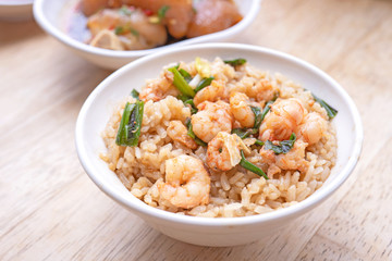 Braised shrimp over rice - Taiwan famous traditional street food. Soy-stewed prawn on cooked rice. Travel concept, top view, copy space, close up