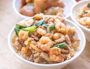 Braised shrimp over rice - Taiwan famous traditional street food. Soy-stewed prawn on cooked rice. Travel concept, top view, copy space, close up