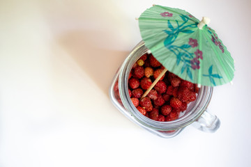 Jar with strawberries on a white background 4